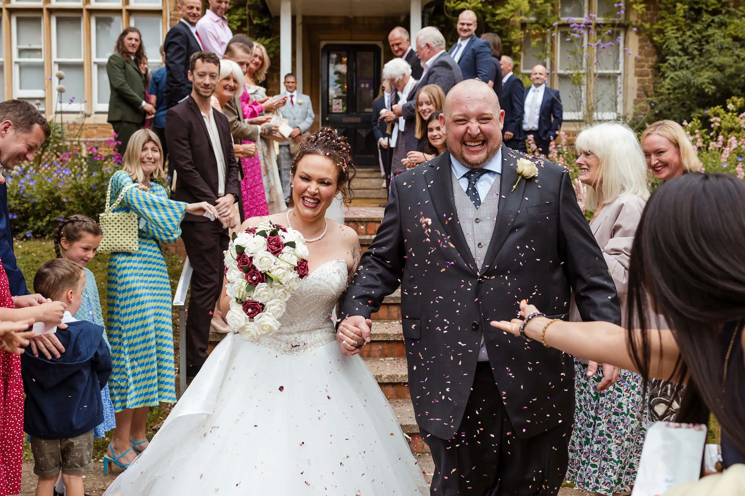 Guildford registry office - couple coming out from the ceremony - confetti shot 