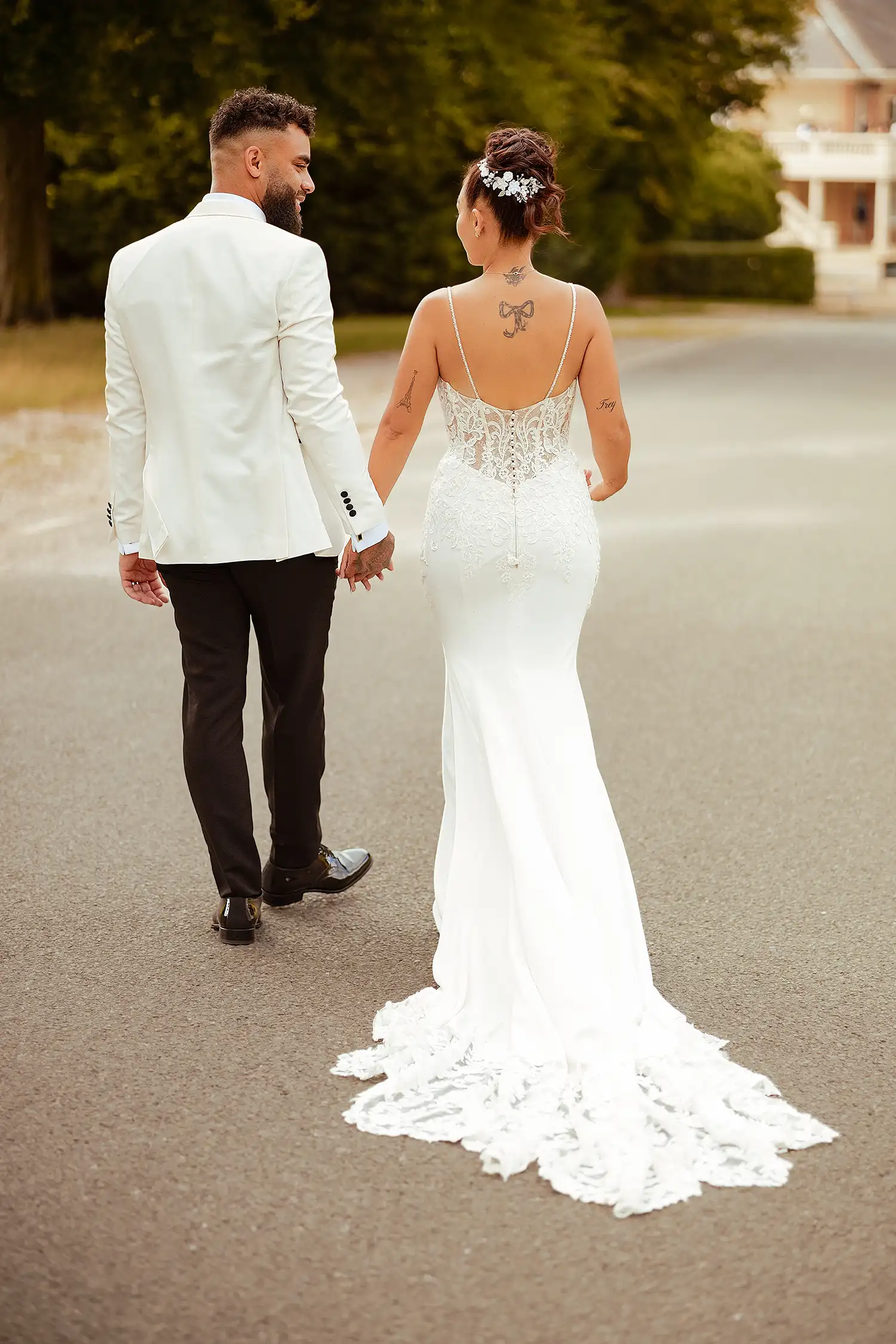 bride and groom walking on a alee on a golf club | VasPhotography