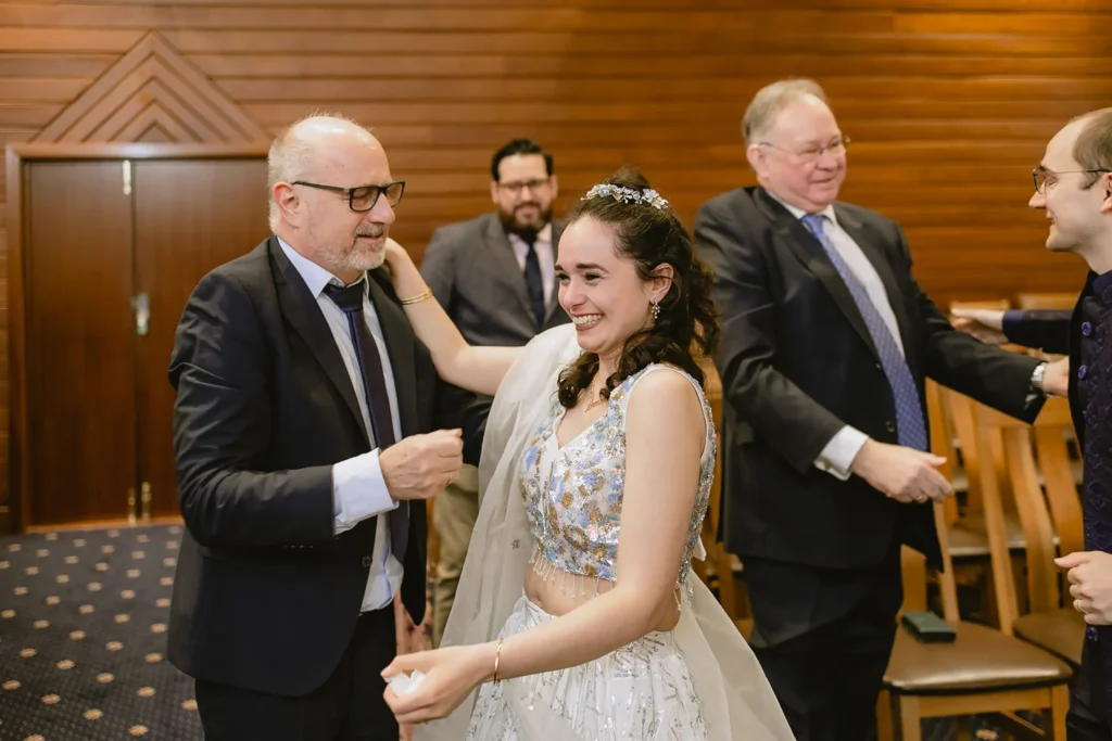 The bride laughing and celebrating with family and guests immediately following the ceremony, captured beautifully during small wedding photography in Southampton by VasPhotography
