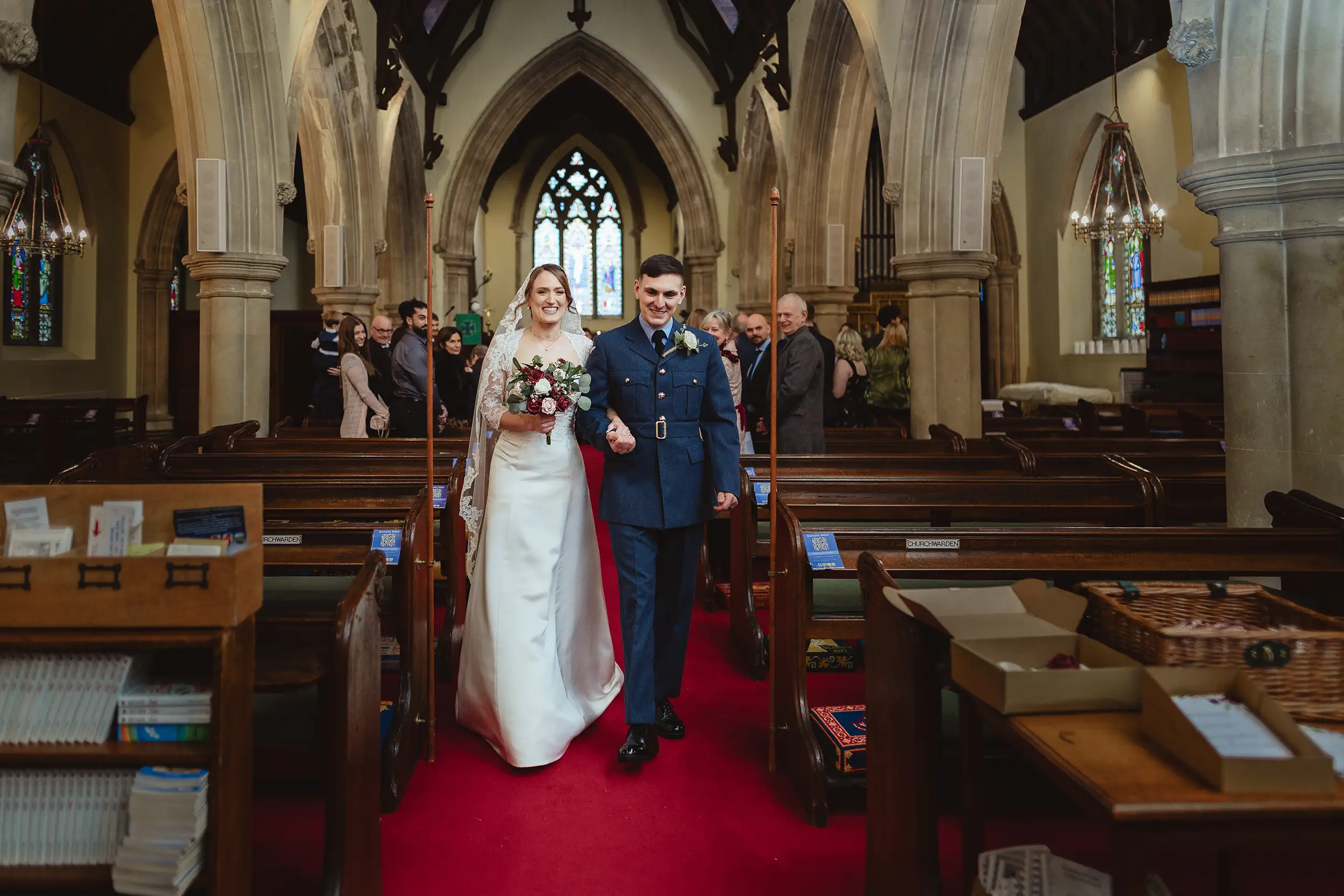 all saints church hursley, wedding couple exiting after ceremony 
