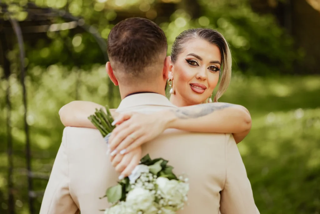 Bride in white dress portrait at Guildford Registry Office gardens, elegant wedding photography Surrey
