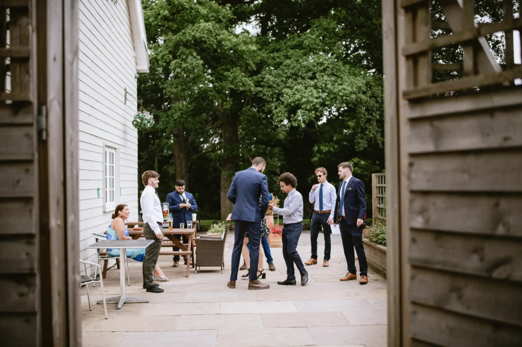 people at The Angel Hotel, Alton, Hampshire — candid wedding photography by VasPhotography