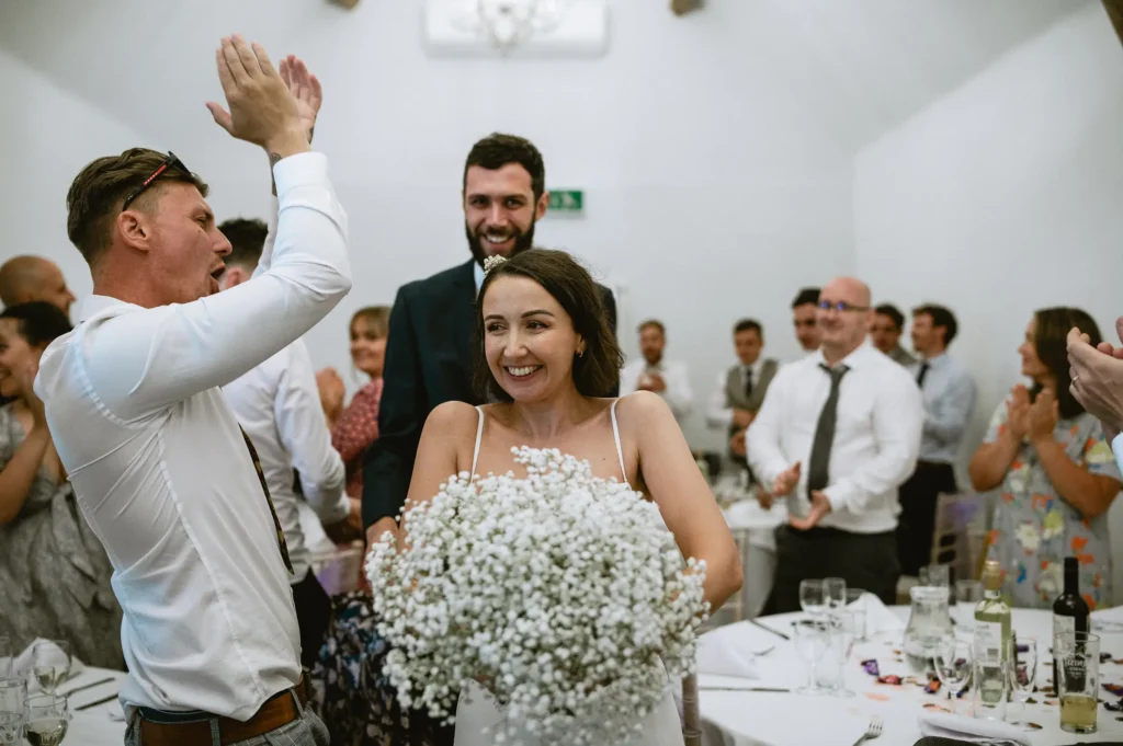 bride and groom entering the venue at The Angel Hotel, Alton, Hampshire — candid wedding photography by VasPhotography