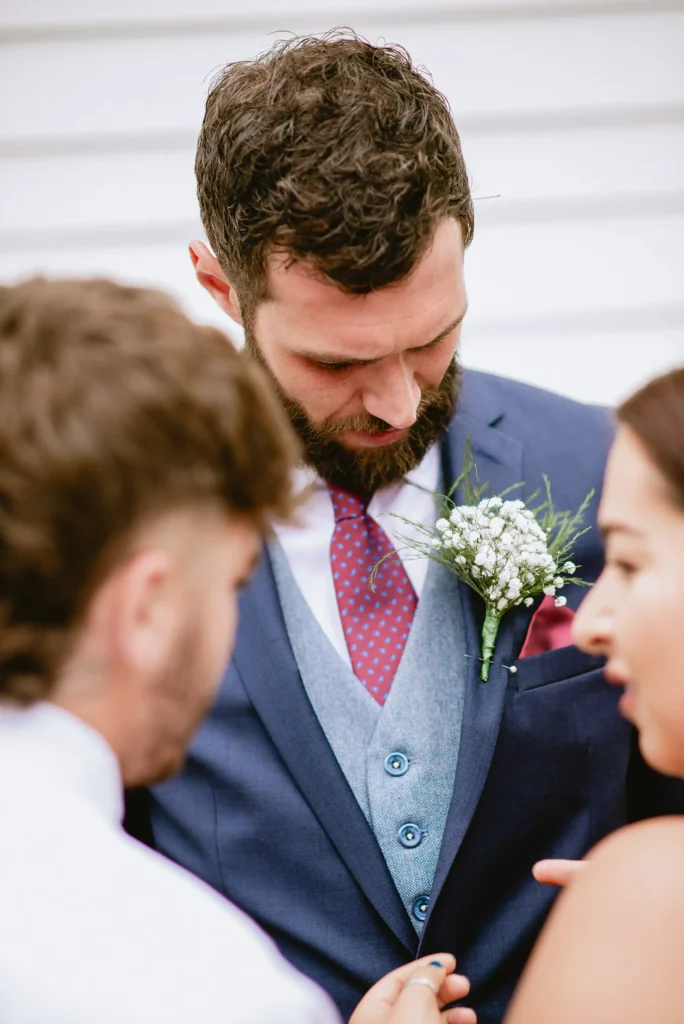 candid groom at The Angel Hotel, Alton, Hampshire — candid wedding photography by VasPhotography
