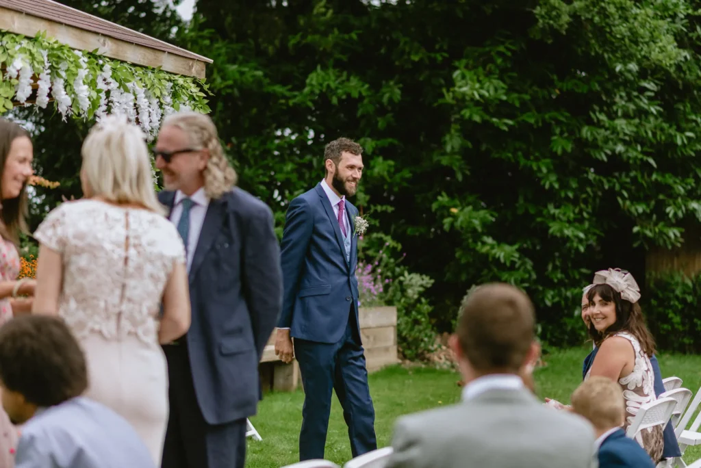 grrom candid moment at The Angel Hotel, Alton, Hampshire — candid wedding photography by VasPhotography