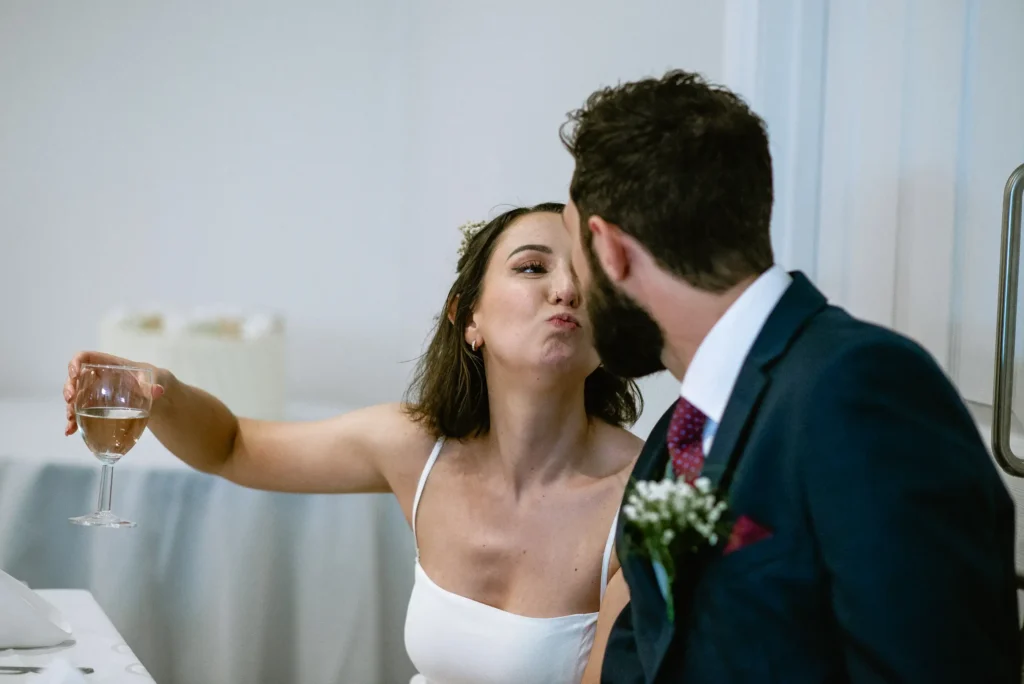 bride and groom having a fun moment at The Angel Hotel, Alton, Hampshire — candid wedding photography by VasPhotography